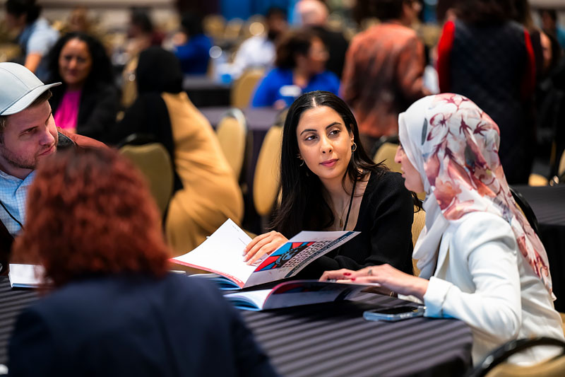 Attendees in conversation at NIIC