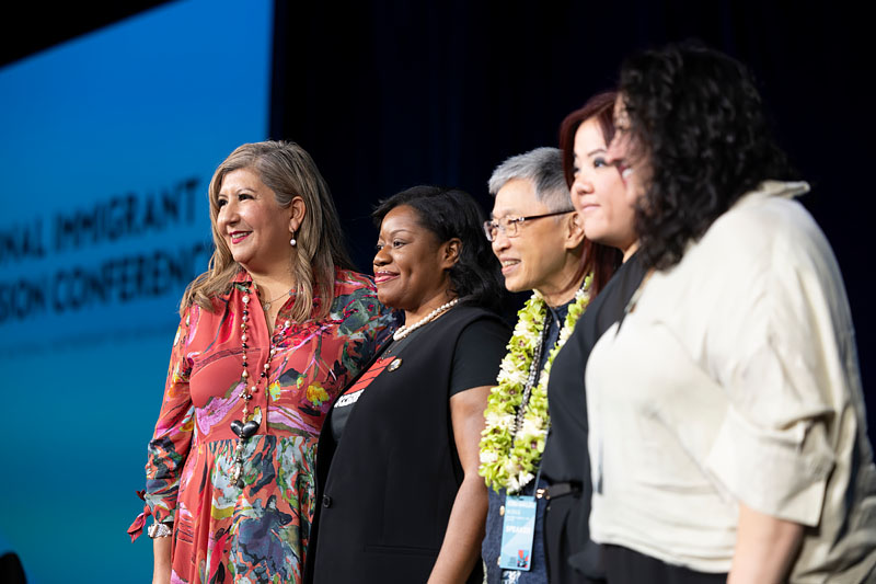 A speaker addressing the NIIC audience